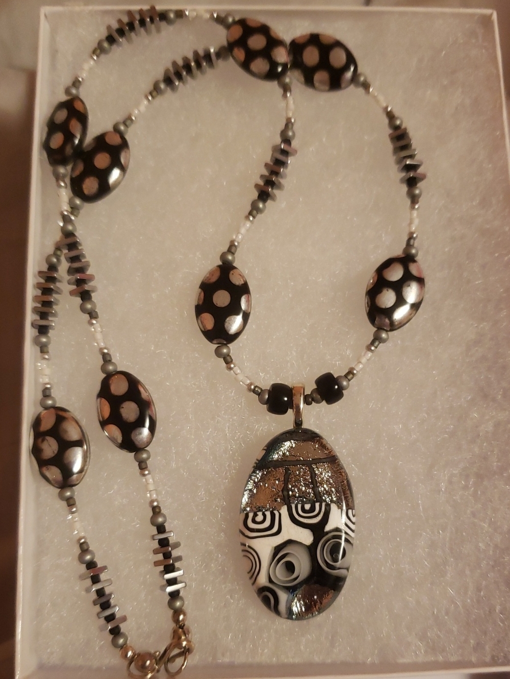 Oval face pendant Necklace crafted with a spilt Modernist design.